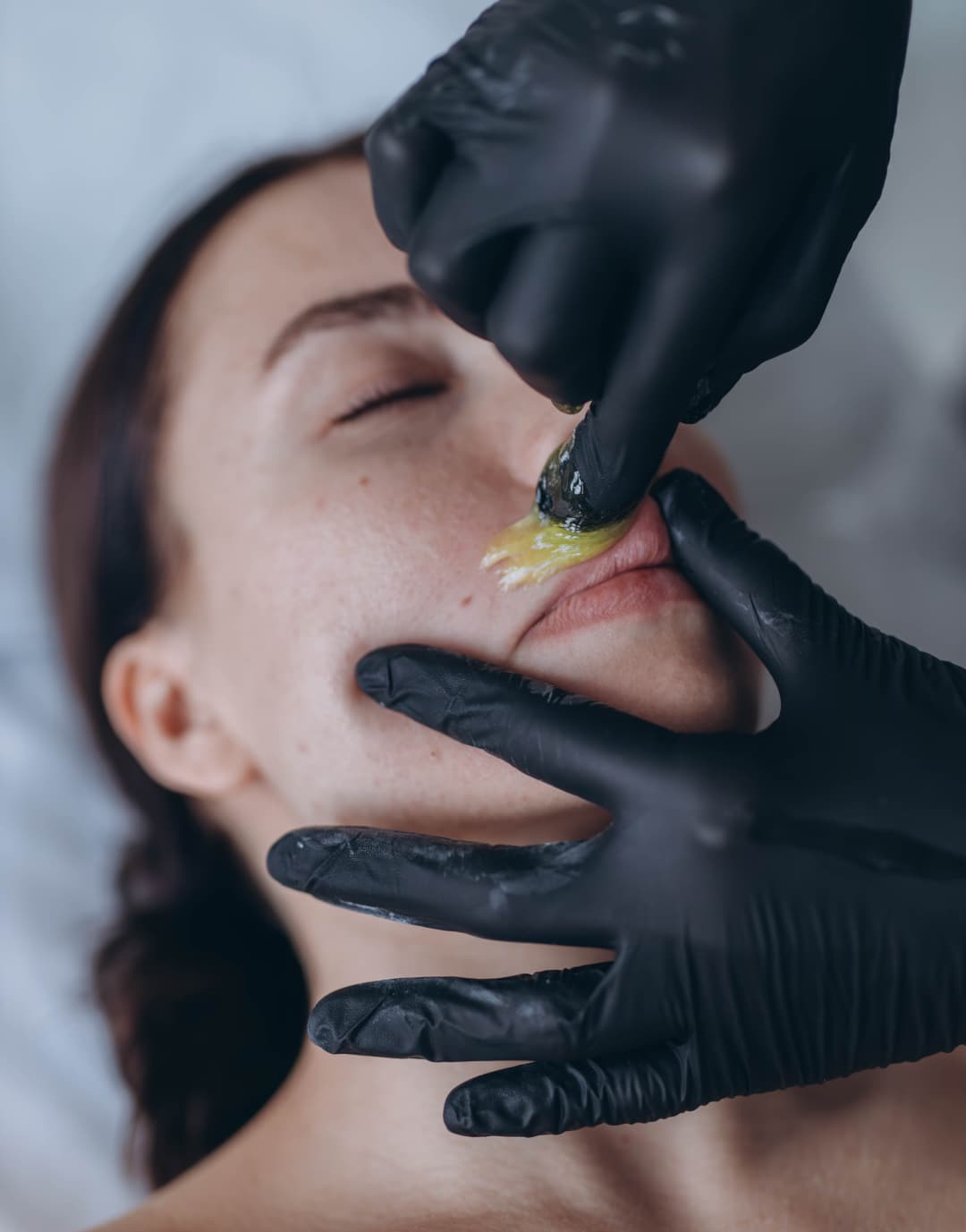 removing-hair-above-upper-lip-of-young-woman-in-sa-2026-03-20-03-46-19-utc (1)