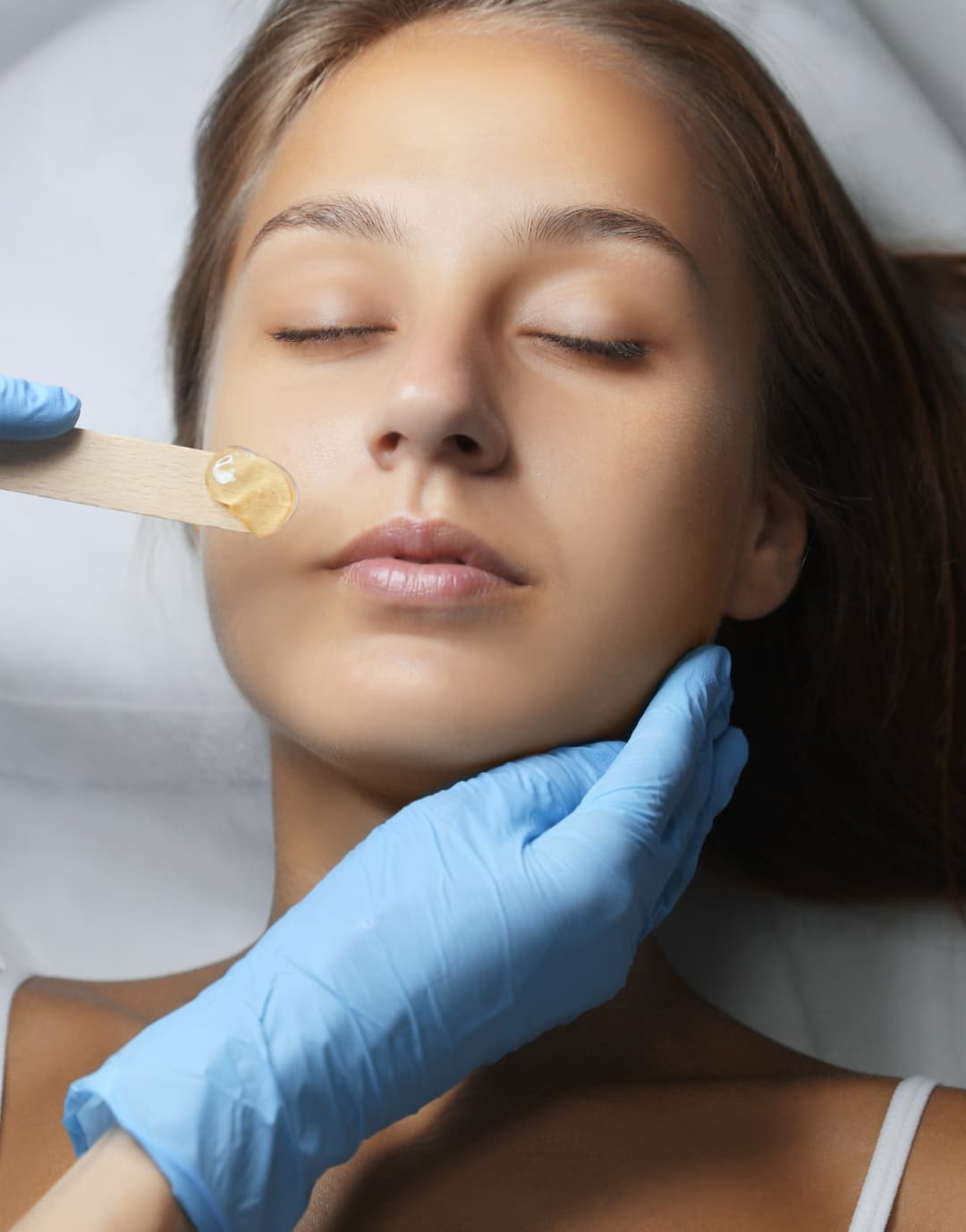 young-woman-undergoing-hair-removal-procedure-on-f-2026-03-27-02-04-41-utc (1)